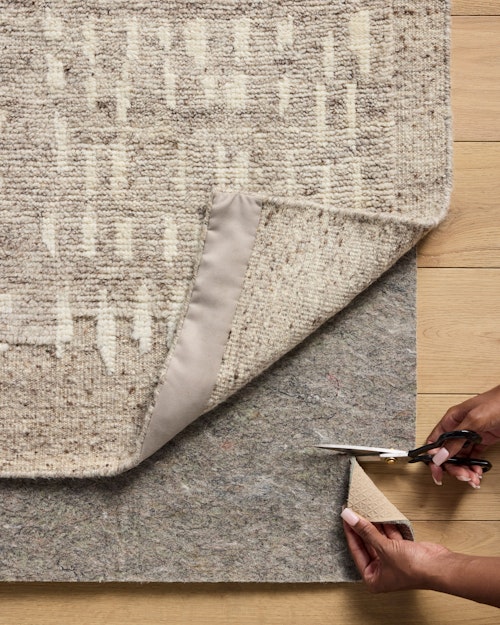 Easily trimmed to fit perfectly under your rug.