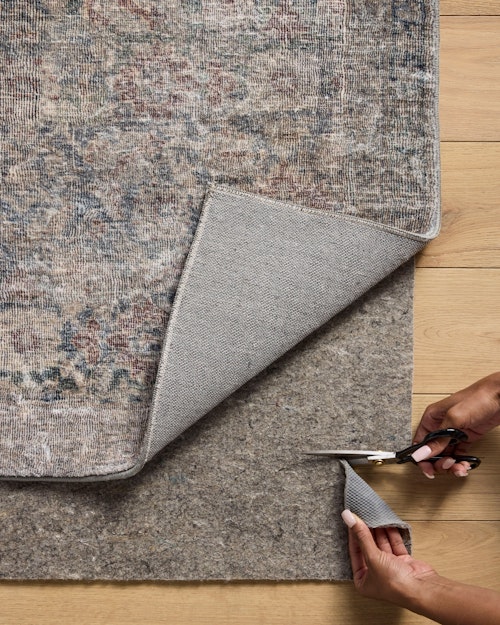 Easily trimmed to fit perfectly under your rug.